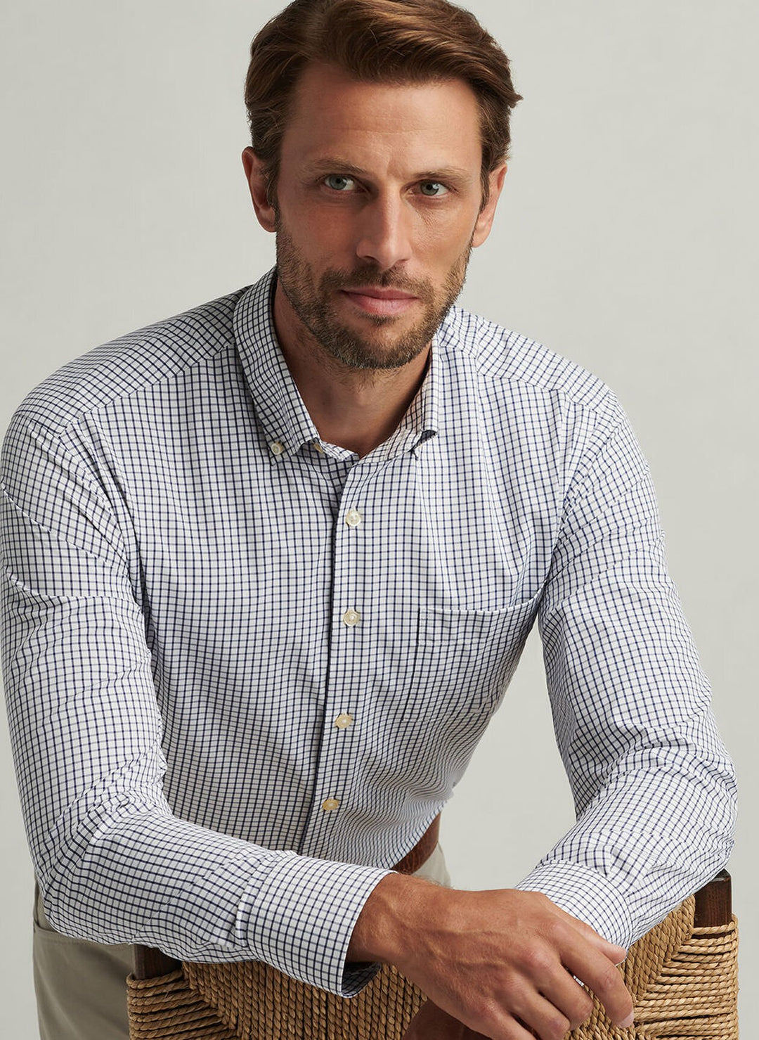 Man wearing a blue Peter Millar button-down shirt
